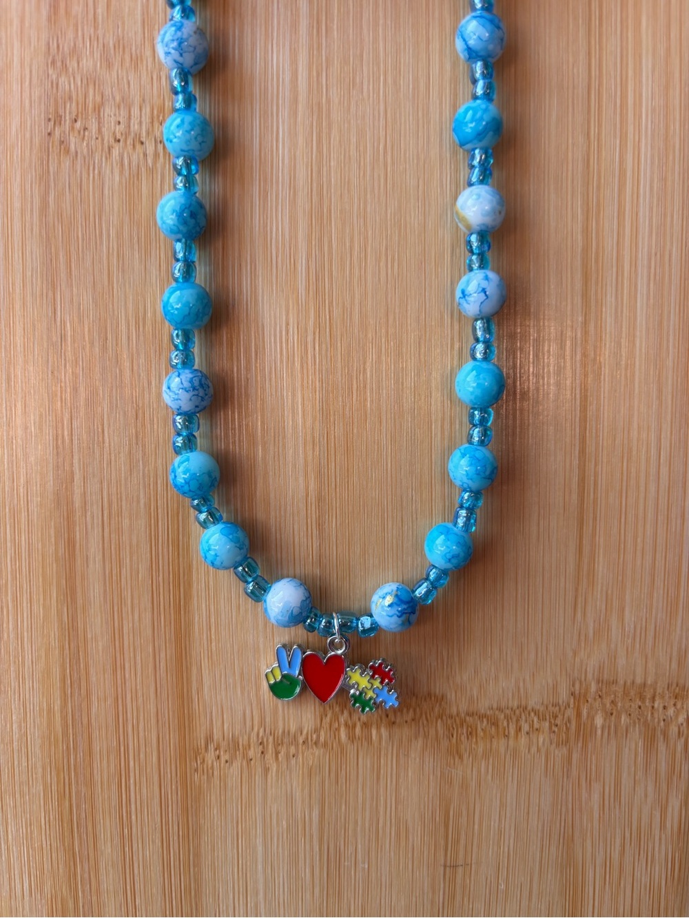 Blue Beaded Charm Necklace with Heart & Autism Awareness Puzzle Charm